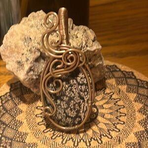 Stunning snowflake obsidian/flower blossom obsidian wrap in copper.